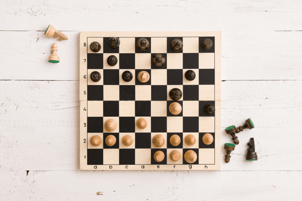 Chess set on wooden table
